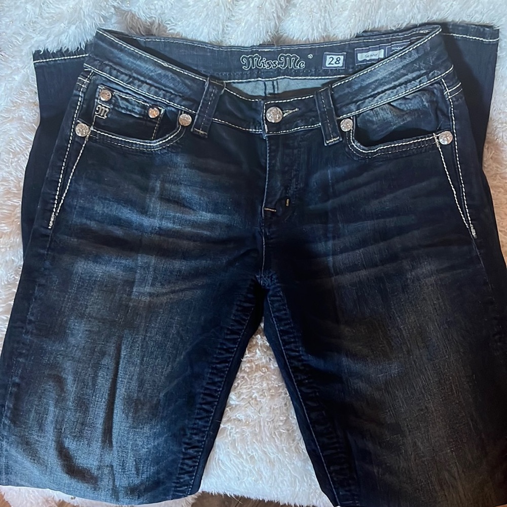 Miss Me dark washed and slightly distressed skinny jeans